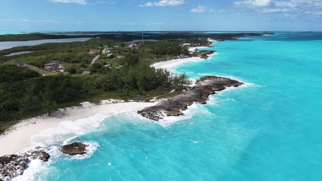 Aerial view of Forbes Hill Beach with gentle waves on Great Exuma in the Exumas, Bahamas.