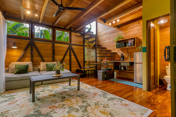 Wooden tiny house interior with living room kitchen