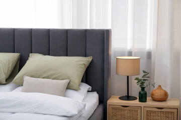 Fototapeta premium Comfortable bed with stylish linens at home, closeup