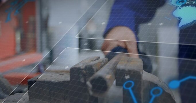 Technician hand approaching from right, gripping metal tubes in bench vise, securing for machining