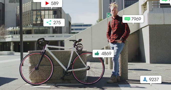 Man leaning against concrete post in urban plaza, bike being locked, overlays showing rim for ads