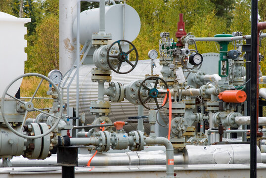 Canada, BC, Fort Saint John.  Pipes and valves at natural gas compressor site.