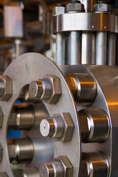 Canada, BC, Fort Saint John.  Stainless steel valve covers and equipment at natural gas compressor site.