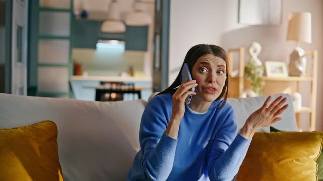 Son distracting calling mother sitting couch closeup. Stressed woman talking