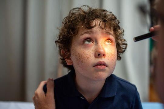 Child eye examination healthcare focus.