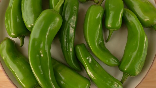 Fresh green chili peppers top view. Selective focus.