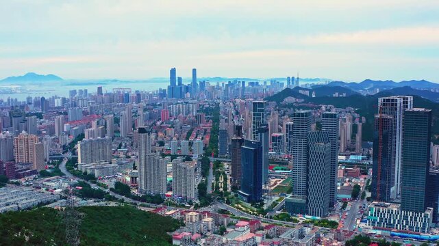 Dalian City Skyline with Mountains and Coastline - Aerial View