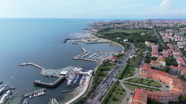 maritime port city of Livorno, Italy, aerial of Casini d'Ardenza, Il Moletto, yacht club and beyond to the commercial shipping hub port