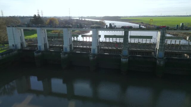Industrial drone perspective of the Relief Channel outfall at King&rsquo;s Lynn, illustrating vital water management systems on the River Great Ouse.