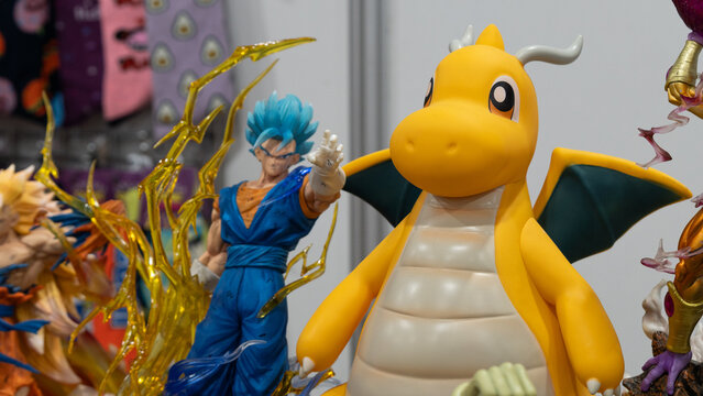 GUAYAQUIL, ECUADOR &ndash; AUG 06, 2023: Anime collectible figures including Dragonite from Pokemon and Vegito from Dragon Ball displayed at a Comic Con collectors event with anime merchandise