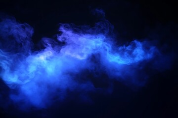 Fototapeta premium An ethereal blue cloud swirls mystically against the inky backdrop like smoke, dreamlike