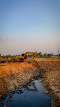 Huai Thalaeng, Thailand &ndash; February 13, 2026 &ndash; A Sany SY135C excavator is working on a pond being dug for agricultural water storage.