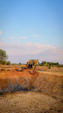 Huai Thalaeng, Thailand &ndash; February 13, 2026 &ndash; A Sany SY135C excavator is working on a pond being dug for agricultural water storage.