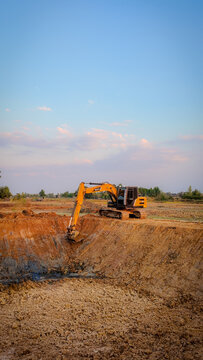 Huai Thalaeng, Thailand &ndash; February 13, 2026 &ndash; A Sany SY135C excavator is working on a pond being dug for agricultural water storage.
