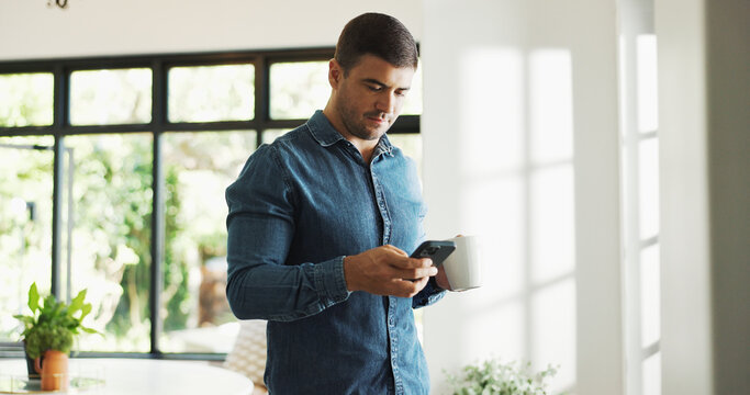 Home, coffee and man with smartphone, texting or communication with contact on web, serious and chat. Reading, online and person with beverage in house, scroll and message with mobile on social media