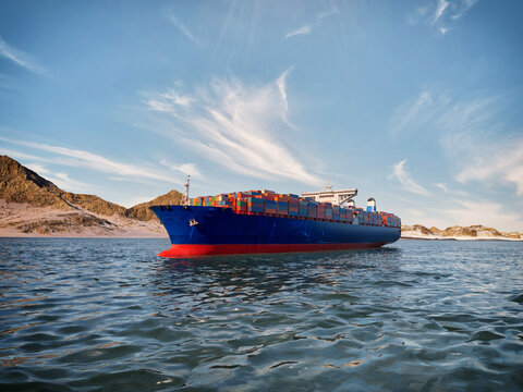 Container ship navigating through the Strait of Hormuz in Middle East 3D render illustration