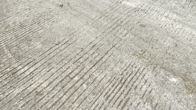 Rough concrete texture surface with parallel grooved patterns