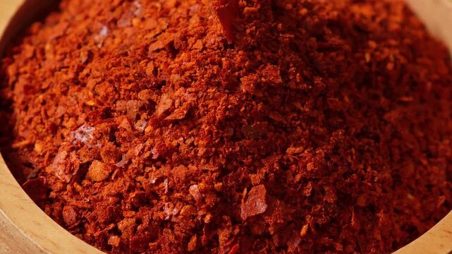 Chili powder in a wooden bowl.	