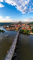 Fototapeta premium Aerial view of a city with a long bridge over a river