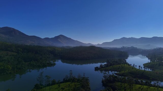 Aerial drone view of lush green tea plantations in Munnar Kerala India scenic landscape