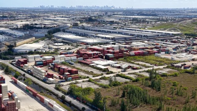 Aerial view of a container shipping yard and industrial logistics park at suburbs of Miami city.