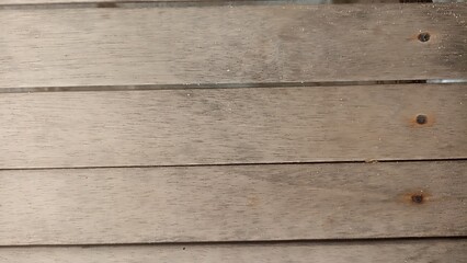 Fototapeta premium Natural Wooden Planks Texture with Visible Screws. Close-up of light wood planks with natural grain and metal screws. Clean rustic background texture