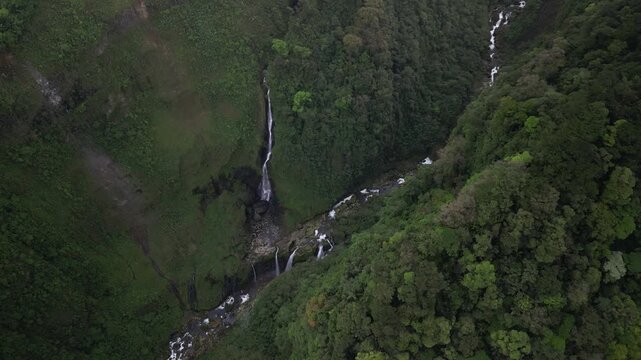 High angle aerial above Quebrada Gata scenic waterfall in Costa Rica near Poas Volcano