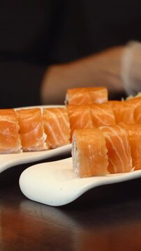 Chef Arranges Sushi, Culinary Expert Meticulously Arranges Salmon Pieces With Precision And Style . Media