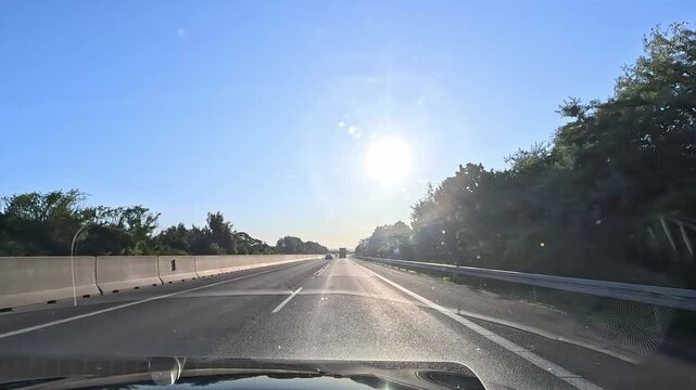Driving on D1 highway in western Slovakia with low sun glare