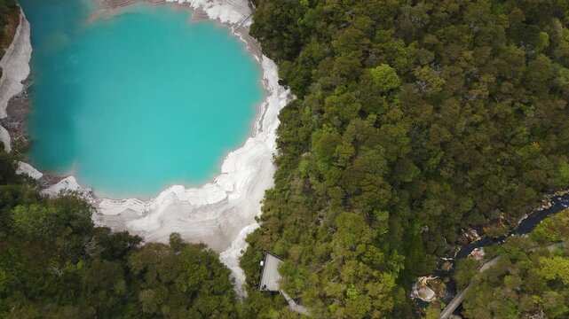 Waimangu Volcanic Valley near Rotorua New Zealand turquoise thermal springs and geothermal landscape from drone fall aerial, natural attraction.