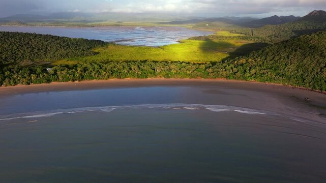 Sunny Twin Casuarina Beach Cove waves sunrise early morning rain clouds Cape Hillsborough National Park Australia aerial drone Hidden Valley Road Orchid Rock Lookout Wedge Island forward pan up