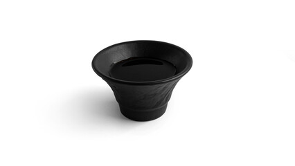 Soy sauce in a saucepan on a white background. High quality photo