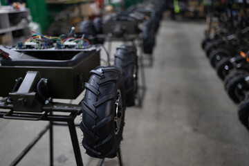 Armed military ground drone in the factory. Production of rodtized complex delivers mine.