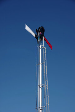 Part of old railway signal under blue sky