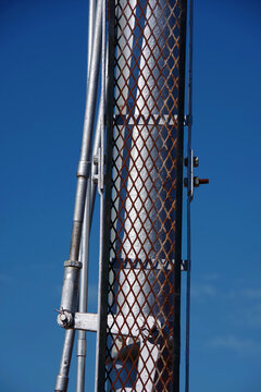 Part of old railway signal under blue sky