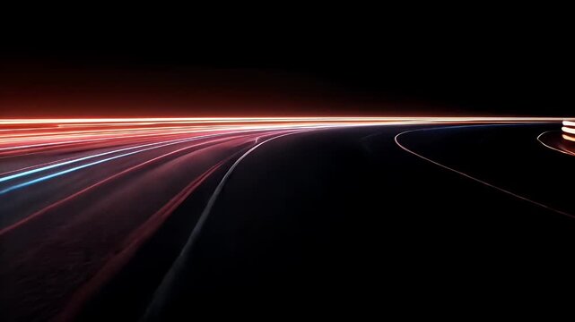 Dynamic Light Trails on a Curved Road at Night with Vibrant Colors and Motion Effects