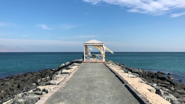 gazebo by the sea in windy weather