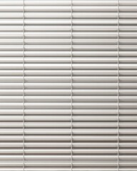 Obraz premium Close-up view of horizontal blinds with a clean, minimalist aesthetic and subtle shadow play