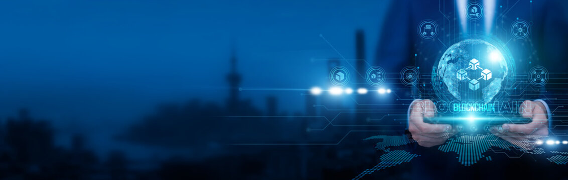 Blockchain analyst holding a smart tablet and pointing at blockchain ledgers on structure distributed nodes and transaction chains. Blockchain technology ensures secure, decentralized data handling.