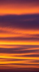 Fototapeta premium Intense early morning sky panorama featuring vibrant orange, yellow, and purple hues stretching across layers of dramatic clouds, heaven, orange, purple