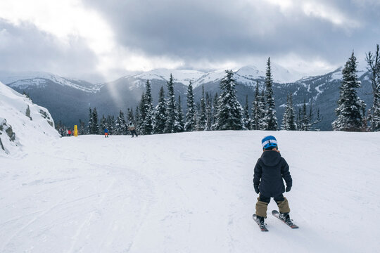 Young boy skis on cloudy day at Whistler Blackcomb