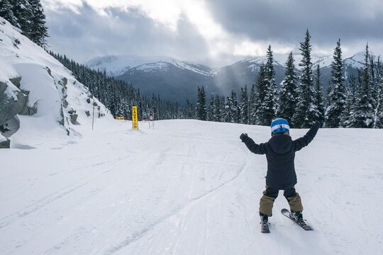 Young boy skis on cloudy day at Whistler Blackcomb