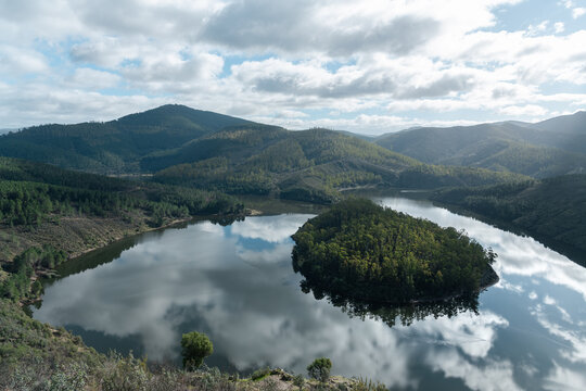 View of Melero meander with forest peninsula and river reflection