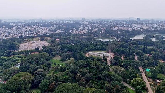 Drone view of Lalbagh Botanical Garden Bengaluru highlighting historic Glass House amidst greenery