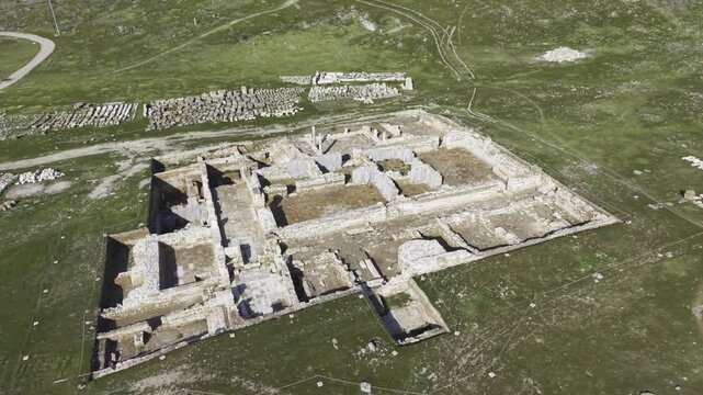 Cinematic aerial drone video of Tripolis Antik Kenti near Buldan in Denizli, Turkey, featuring Roman ruins, columns, stone structures, and panoramic scenic landscape from above.