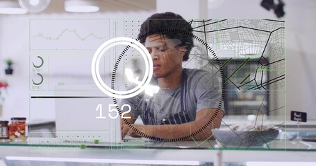 Standing barista in gray T-shirt, dark apron leaning over glass counter with AR overlay © vectorfusionart