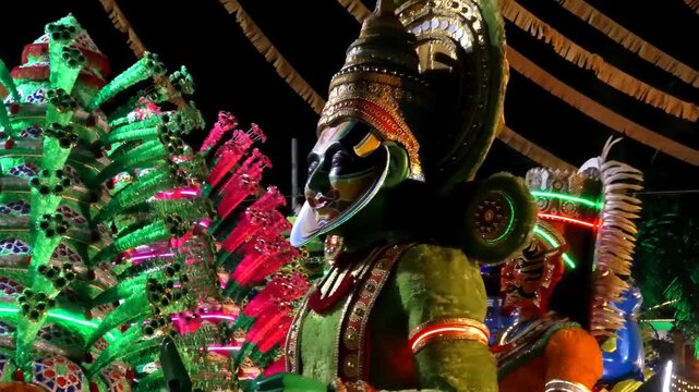 Colorful religious and cultural sculptures displayed in the 'Kavadi' procession of a temple festival in Kerala, India	