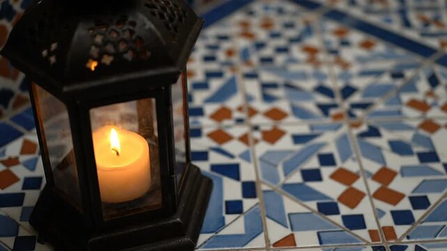 Lantern on Mosaic Tile Floor with Candle.