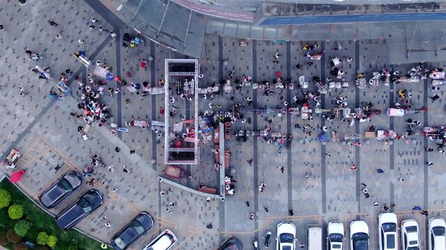 Busy Market Square Aerial View with Crowds and Vendor Stalls