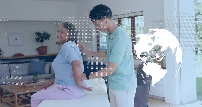 Placing hands on upper back, caregiver assessing and guiding senior into upright posture with globe
